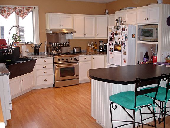 Custom kitchen with slate sink and granite counters