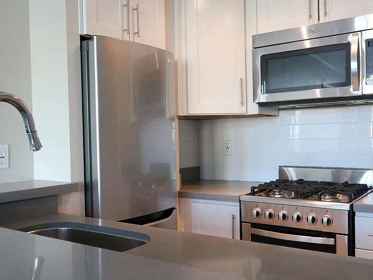 Nob Hill Place ~ Newly renovated residences with stainless steel appliances, quartz counters, polished fixtures, gas stove, microwave, custom white cabinetry, breakfast bar, designer wood flooring,