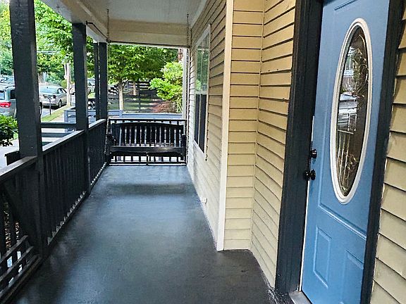 Large front porch (with rods if you want to add porch curtains)
