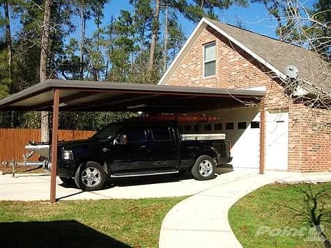 10944 Forest Creek detached garage and carport from side