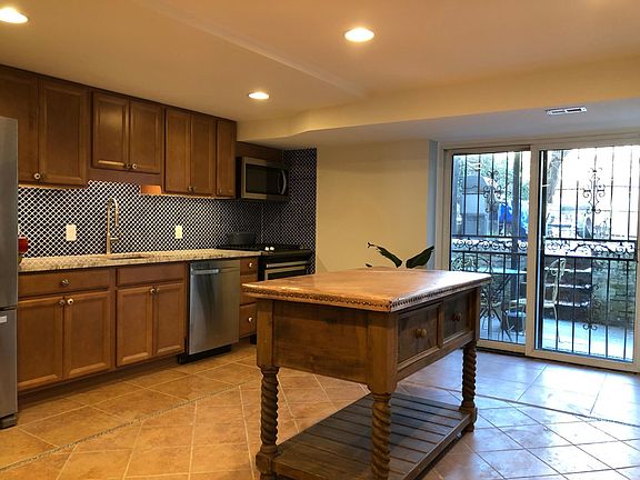 View to garden--lots of lot for a ground floor apartment! Jacobean inspired island with copper surface included.