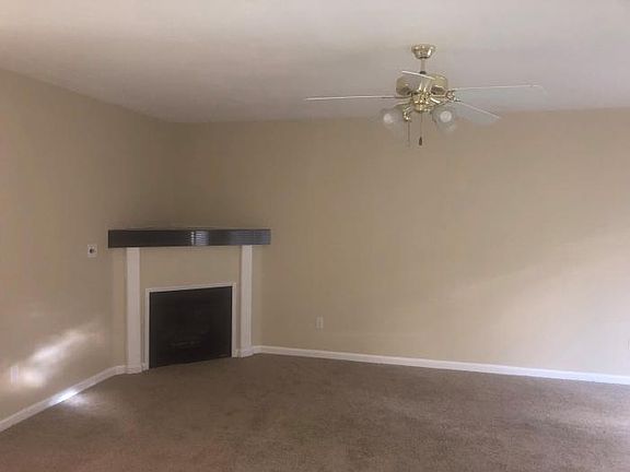 living room fireplace with granite on shelf, keeps entire house heated in the winter