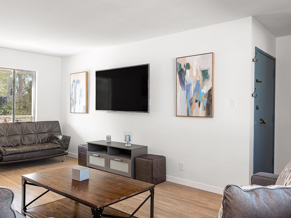 Living Room Featuring a 75 inch color television