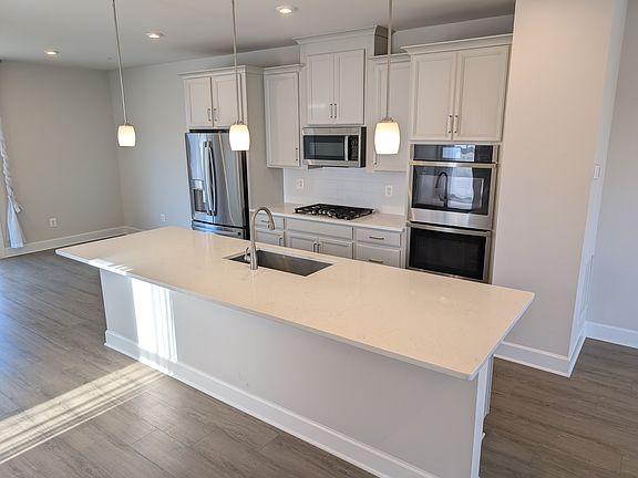 Gourmet kitchen shines with stainless steel.