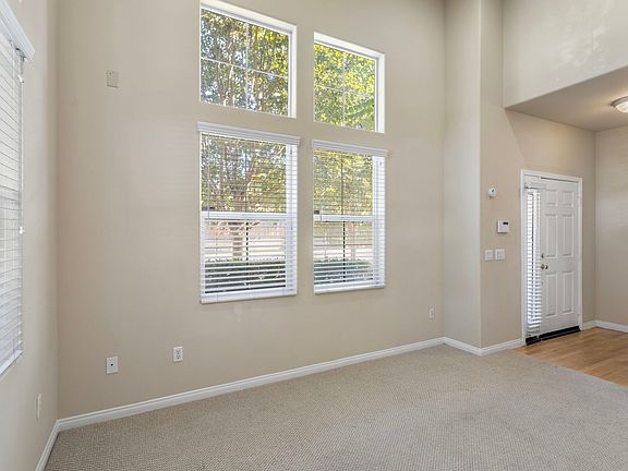 Bright Main Entryway and Main Floor Living Room with High Ceiling