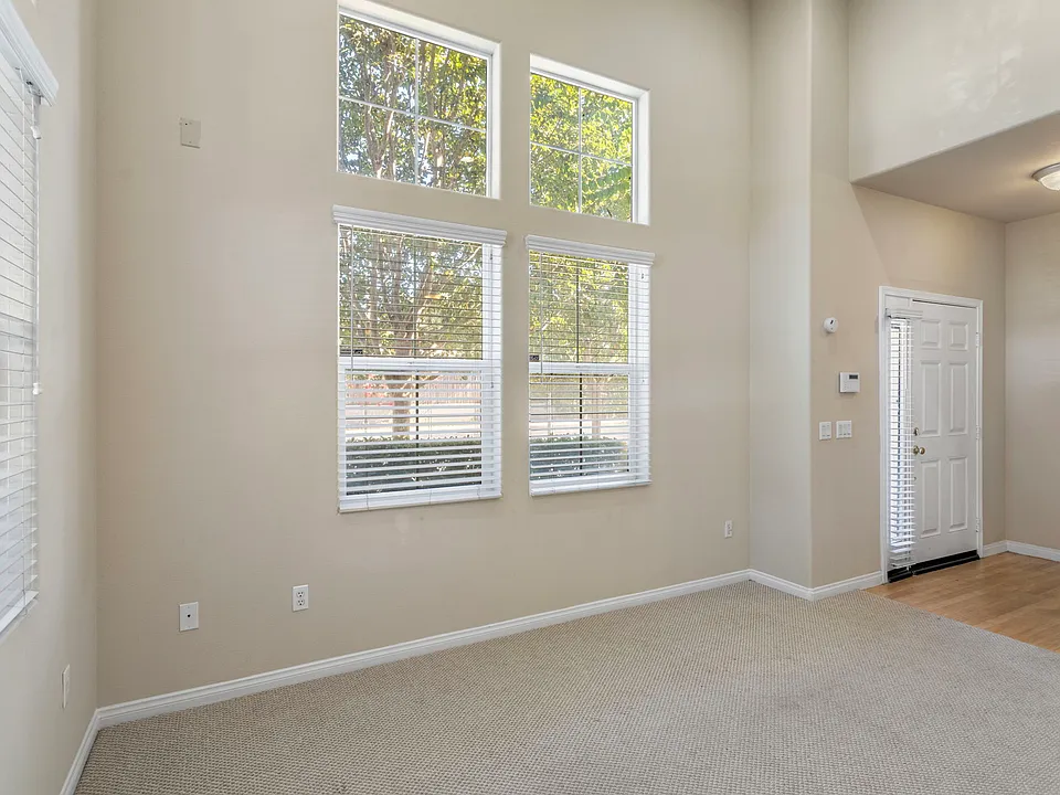 Bright Main Entryway and Main Floor Living Room with High Ceiling