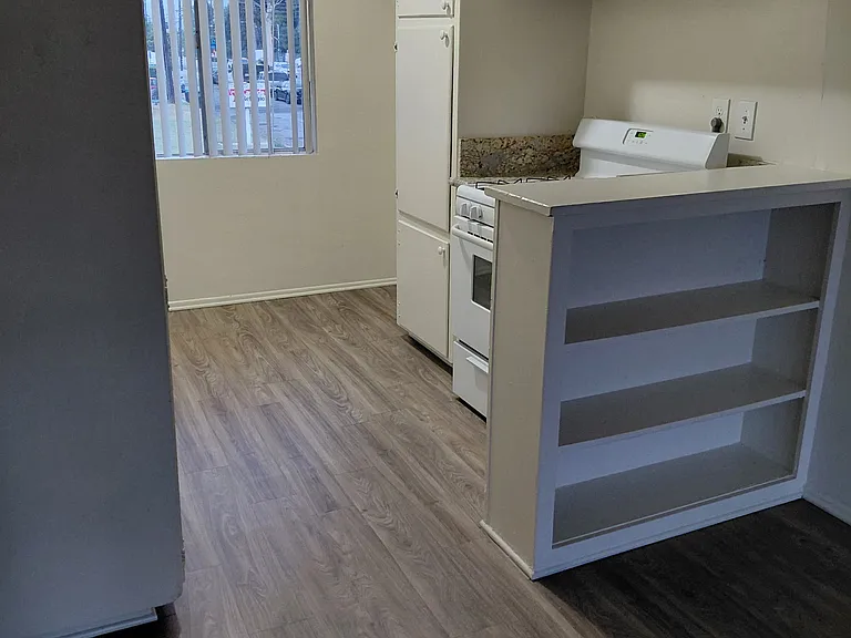 Kitchen with lots of cabinets and storage shelves