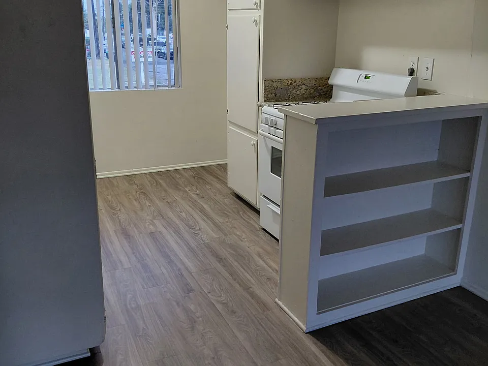 Kitchen with lots of cabinets and storage shelves
