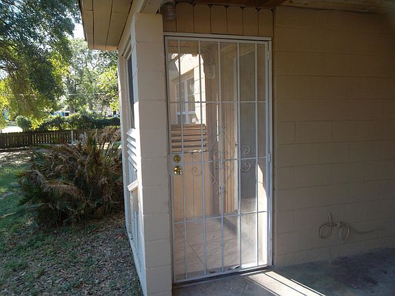 Screened front entrance with lockable security door.