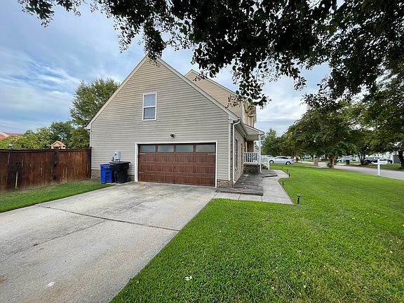 Garage, Driveway, and side view