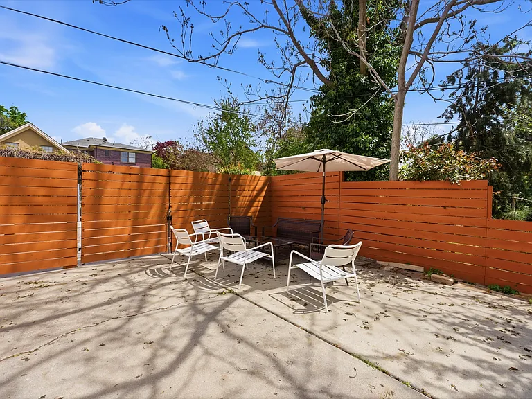 Uppermost patio and additional parking space at the back alley entrance.