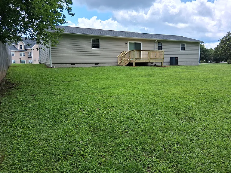 View from the rear part of back yard before the woods commence