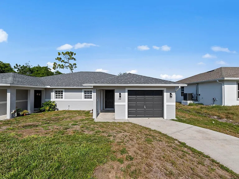 Unit 330 on right hand side. Front view of property. Newer roof, fresh modern paint and great curb appeal