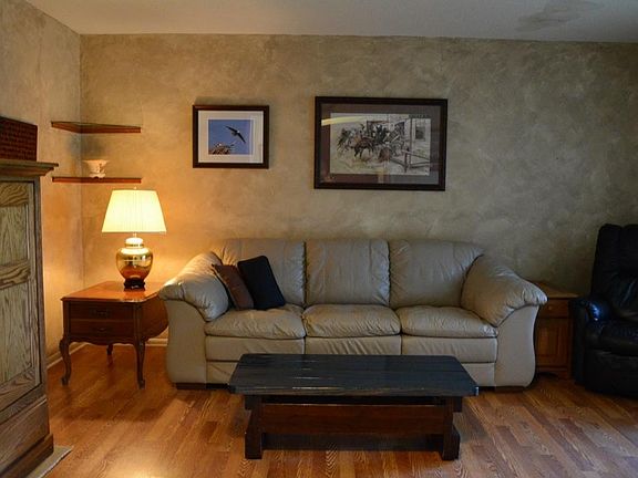 Formal living room with beautiful wood laminate flooring.