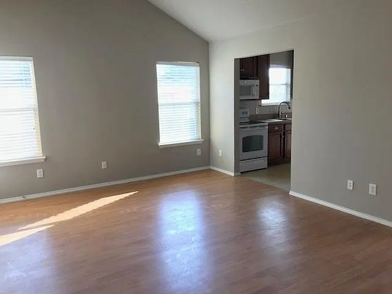 Living room with entry to kitchen