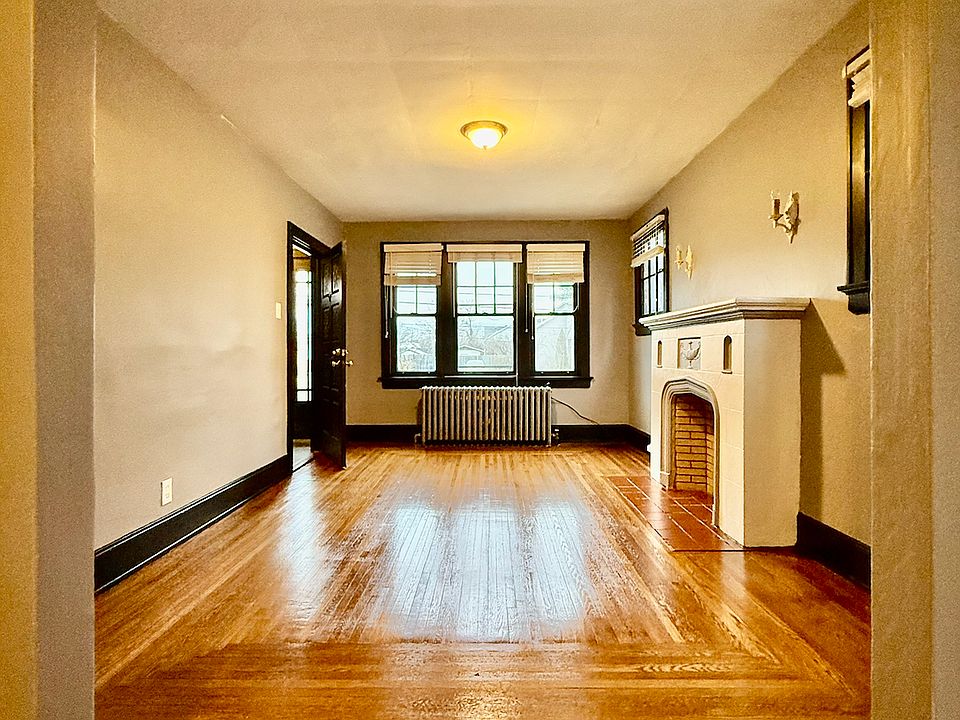 Awesome living room to enjoy with lots of light and old-school charm!