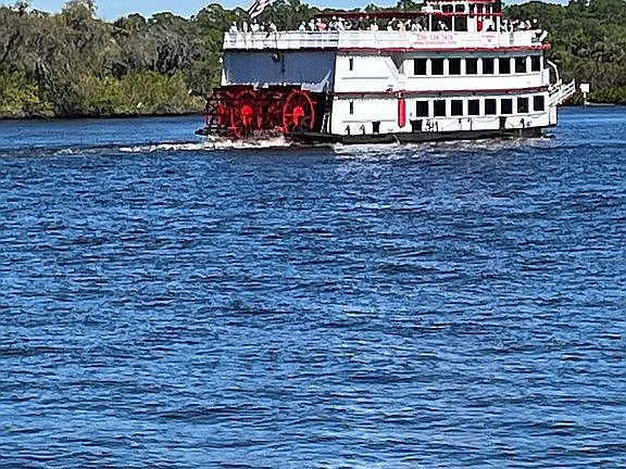 Tour boats heading up river 