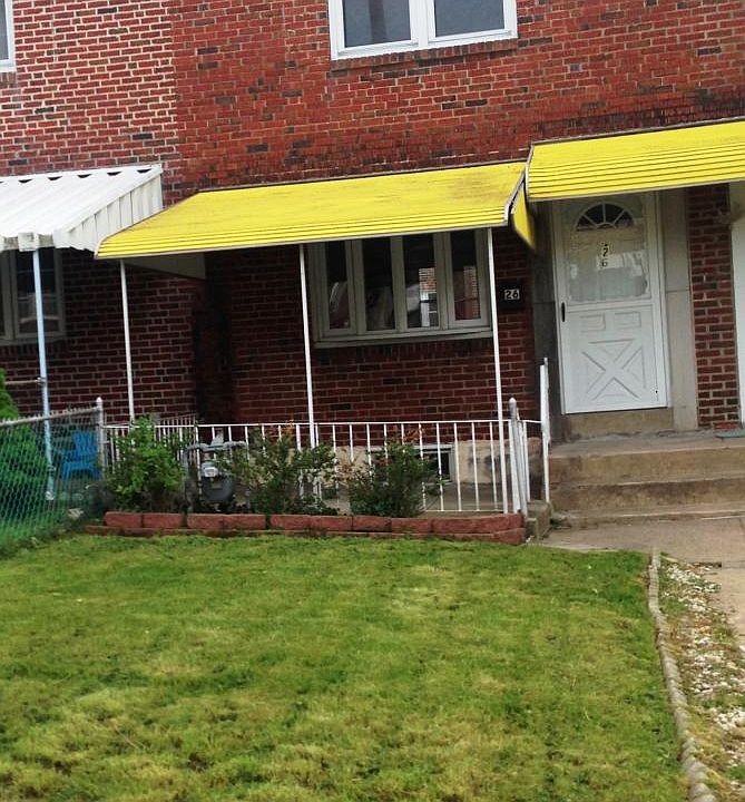 Front with covered patio and entryway