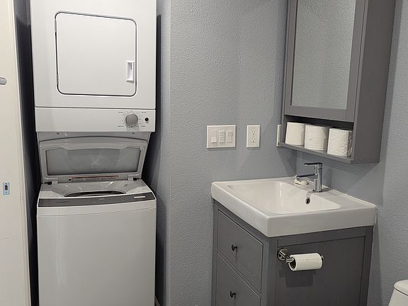 Stacked washer and dryer in the bathroom