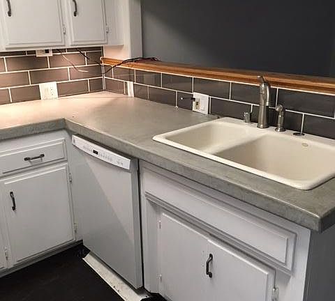 new concrete countertops and subway tile