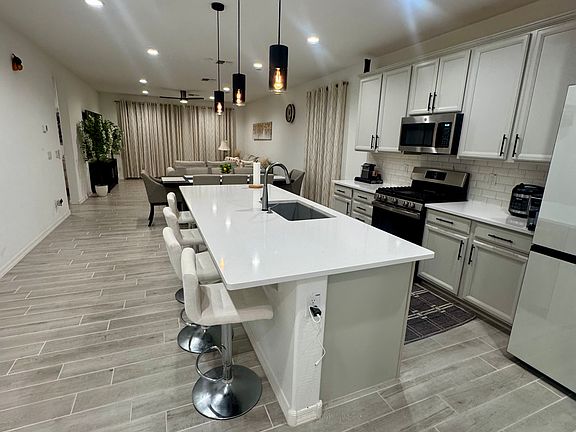 Bright open-concept kitchen and living area with large island