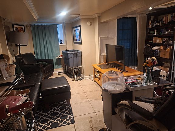 Previous Tenant furnishing - large bookcase on brick wall