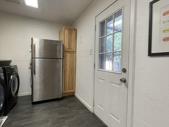 Door to backyard and 2 car garage