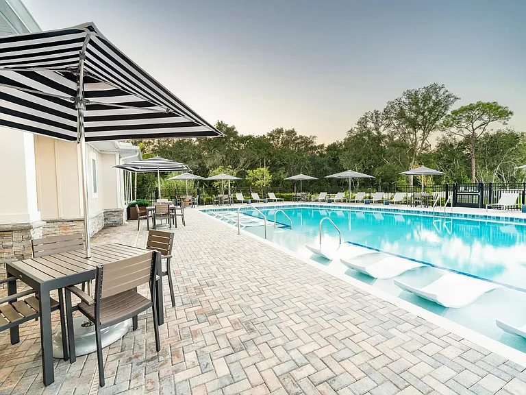 Relax beside the shimmering pool at Amavi Kissimmee, with inviting spaces that keep you close to the everyday conveniences and attractions that define the area.