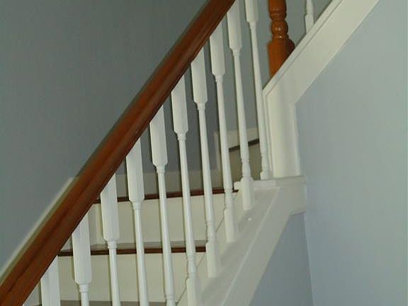 Stairway in foyer with landing.