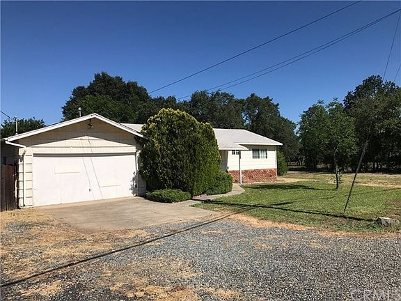 2 car garage, extra parking and easy maintenance landscape