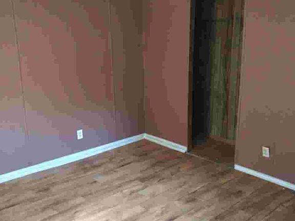 Painted base board mouldings... linoleum floors for easy cleaning.