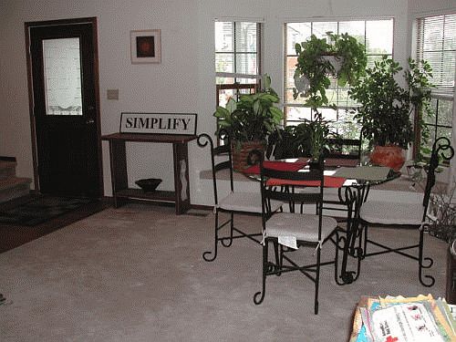 Front door entry; living room with window seat
