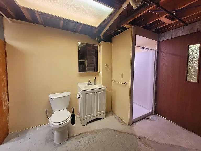 Basement level bathroom with stand up shower