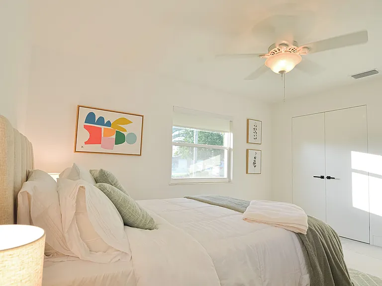 Second bedroom, queen bed with smart TV, closet and dresser