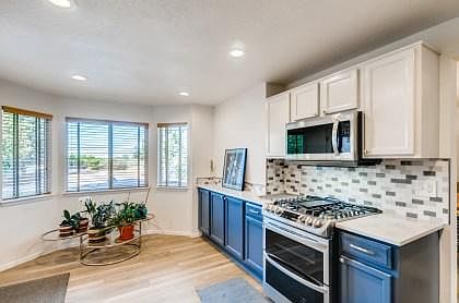 Kitchen and breakfast nook with access to back yard