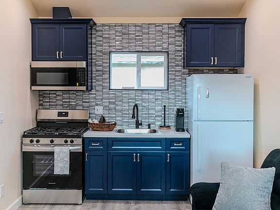 Full Kitchen with Gas Stove, garbage disposal, and full range microwave.