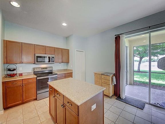 Kitchen ~ Opens to Spacious Screened Lanai.