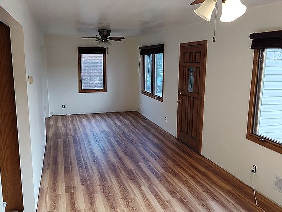 Living room, front door- before new trim, and outlet covers