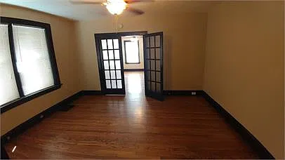 Spacious bedroom complete with French Doors and New Windows Throughout!