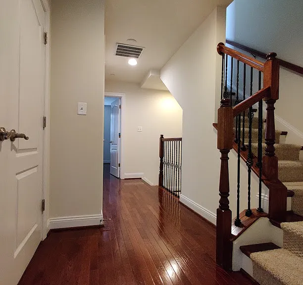 Hallway leads to loft and connects 2 bedrooms at each end of 3rd floor