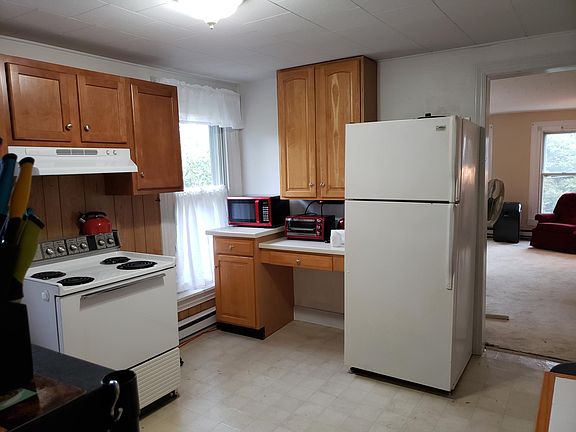 Kitchen with appliances. Range and Refrigerator landlord responsibility. All other appliances tenant responsibility.