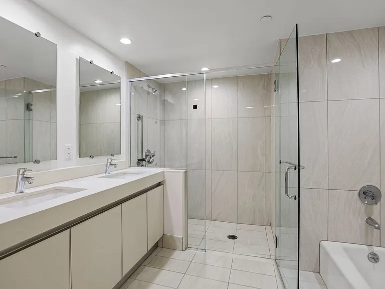 Master Bathroom with Walk-In Shower, Bathtub, and Double-Sink Vanity with Cabinet Storage
