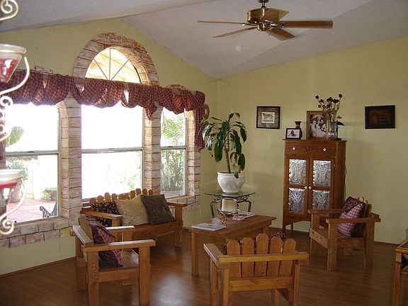 Formal living room overlooks the front porch. Truly country-living at it's bes