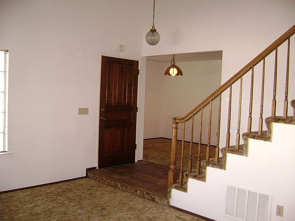 Front door, living room, dining room, stairs to up upstairs bedrooms