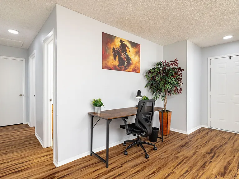 Productive workspace featuring a sleek desk, comfortable chair, and inspiring decor.
