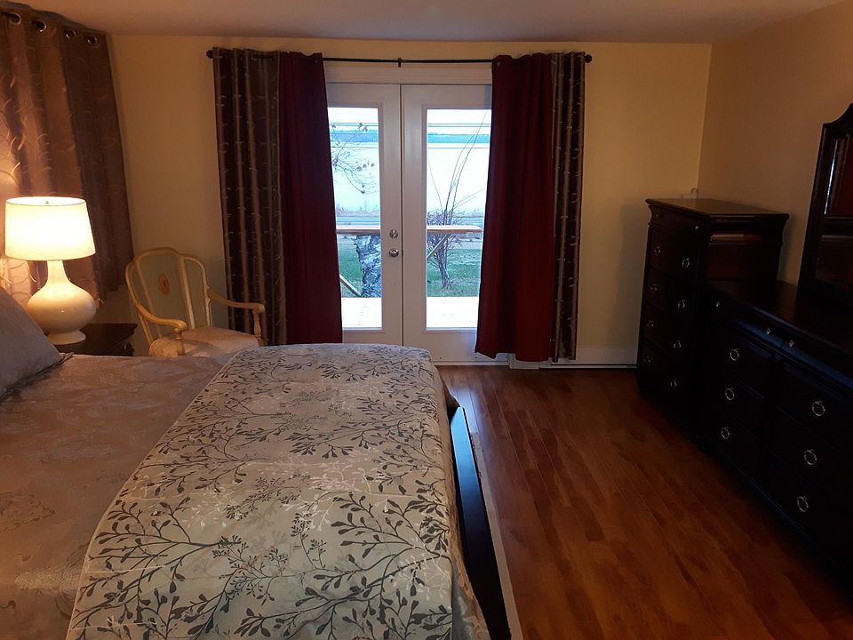 master bedroom with french doors to deck with ocean view
