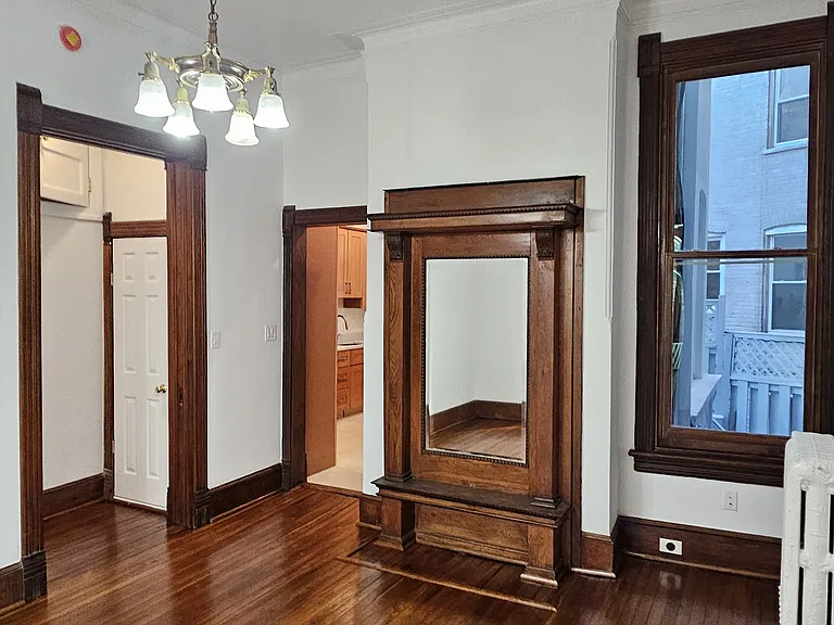 1st floor: dining room with mirror mantle and access to rear kitchen.