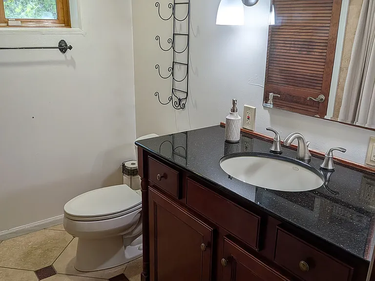 Garden level bathroom in the Suite with shower, heated tiles, closets and its own washer/dryer