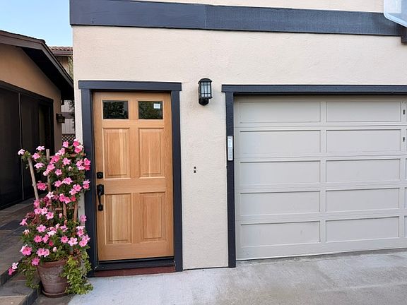 Brand new door and entryway. Washer and dryer located in the garage. Homeowner uses garage as storage for bikes and other items. Tenant can store a few items here, but keep in mind garage is opened and closed often.