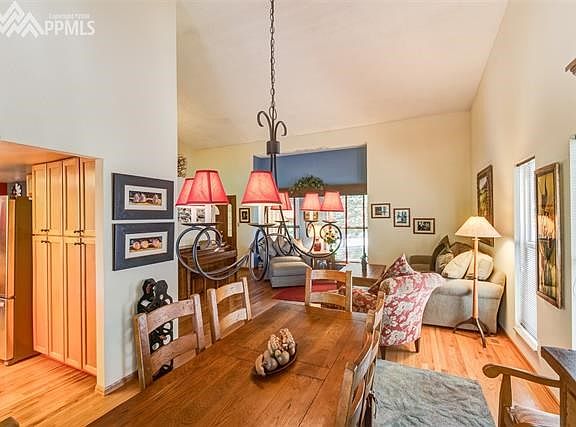 View from dining room into living room & into kitchen, open & bright!